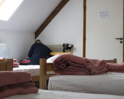 Martin trying to boost the central heating at the hostel. To Nasbinals. Via Podiensis. France. Martin trying to boost the central heating at the hostel. To Nasbinals. Via Podiensis. France.